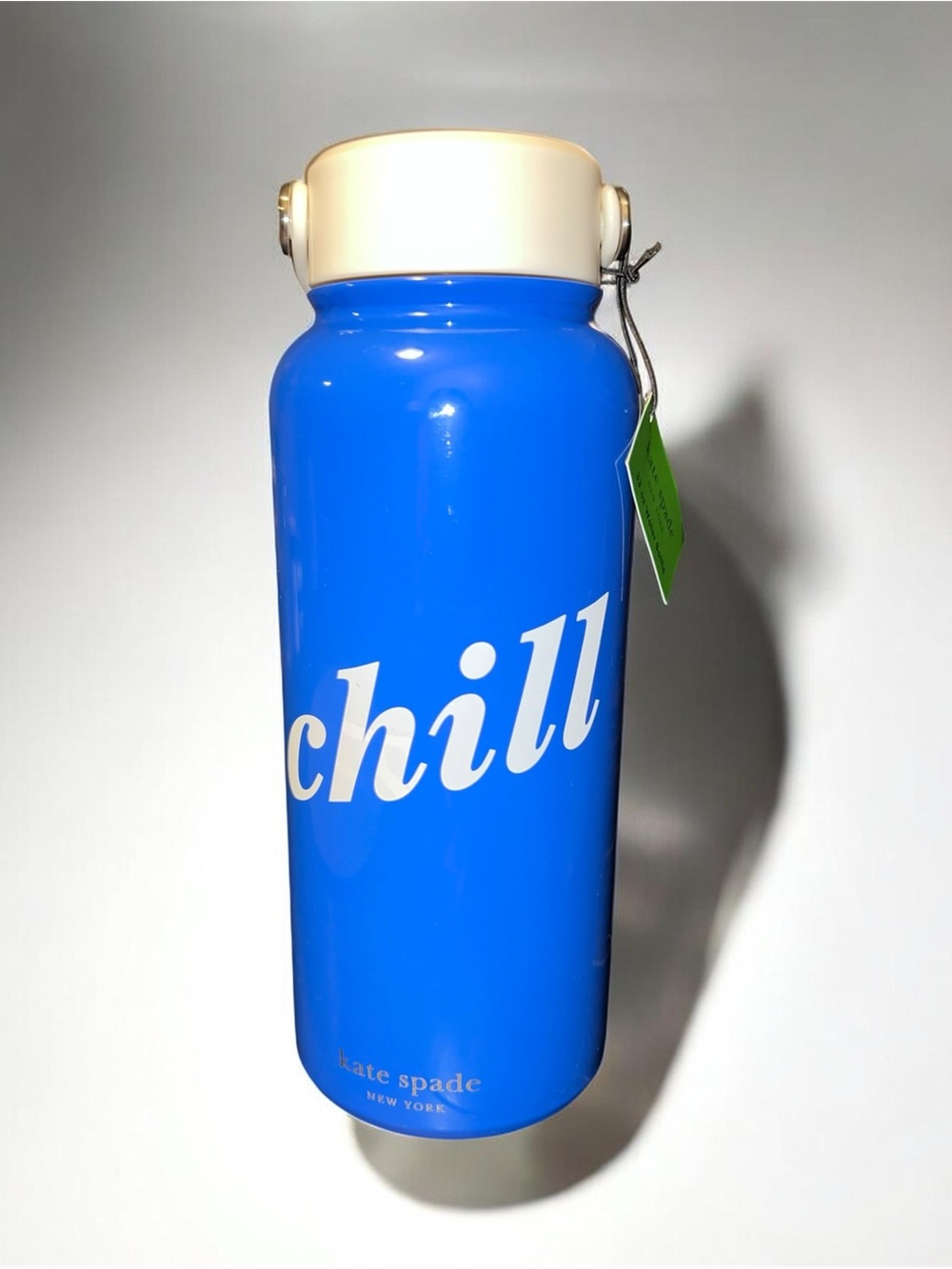 kate spade blue insulated bottle with cream lid and "chill" script